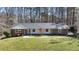 Charming single-story brick home with a well-manicured lawn and mature trees in a quiet neighborhood at 2415 Bankstone Sw Dr, Marietta, GA 30064