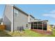 Home backyard with privacy fence, sunroom and green grass at 3464 Enterkin Ln, Atlanta, GA 30349