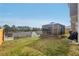 Spacious backyard featuring a sunroom, perfect for outdoor relaxation and entertainment at 3464 Enterkin Ln, Atlanta, GA 30349