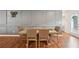 Dining room featuring stylish decor, paneled walls, and wood-look flooring at 3464 Enterkin Ln, Atlanta, GA 30349