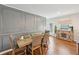 Dining room featuring paneled walls and wood-look flooring at 3464 Enterkin Ln, Atlanta, GA 30349