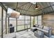 Stylish outdoor gazebo with TV, fan, and comfortable lounge area for relaxing and entertaining at 3464 Enterkin Ln, Atlanta, GA 30349