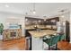 Kitchen features granite countertops, stainless steel appliances, and a spacious kitchen island with breakfast bar at 3464 Enterkin Ln, Atlanta, GA 30349