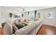 Comfortable living space with a sectional sofa and views of the window and entrance door at 3464 Enterkin Ln, Atlanta, GA 30349
