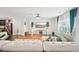 Bright and airy living room with hardwood floors, large windows, and modern decor for a relaxing ambiance at 3464 Enterkin Ln, Atlanta, GA 30349