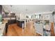 Open-concept living area features wood floors and modern kitchen with stainless steel appliances at 3464 Enterkin Ln, Atlanta, GA 30349