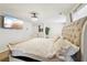 Cozy main bedroom features a large bed, accent lighting, and modern wall-mounted television at 3464 Enterkin Ln, Atlanta, GA 30349