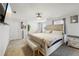Bright main bedroom features stylish decor, wall-mounted TV, and comfortable seating area at 3464 Enterkin Ln, Atlanta, GA 30349