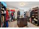 Spacious walk-in closet with extensive storage solutions, including shelves, drawers, and racks for clothes and accessories at 3464 Enterkin Ln, Atlanta, GA 30349