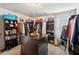 Well-organized walk-in closet featuring custom shelving, racks, a dresser and ample space for storage at 3464 Enterkin Ln, Atlanta, GA 30349