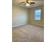 Spacious bedroom features neutral carpet, ceiling fan and a window for ample natural light at 988 Old Holcomb Bridge Rd, Roswell, GA 30076