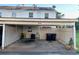 Carport featuring parking space for two cars with a storage area and house number 988 at 988 Old Holcomb Bridge Rd, Roswell, GA 30076