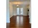 Dining room with hardwood floors, modern lighting and access to outdoor space at 988 Old Holcomb Bridge Rd, Roswell, GA 30076