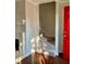 Entryway featuring hardwood floors, staircase, and a vibrant red front door at 988 Old Holcomb Bridge Rd, Roswell, GA 30076