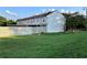 Townhouse with white siding, and spacious fenced yard at 988 Old Holcomb Bridge Rd, Roswell, GA 30076