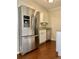 Kitchen with stainless steel refrigerator and white cabinets at 988 Old Holcomb Bridge Rd, Roswell, GA 30076
