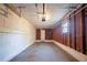 Spacious unfinished garage featuring a concrete floor, and overhead door with opener at 4205 Whittier Ct, Decatur, GA 30034