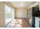 Spacious kitchen with stainless steel refrigerator and a large sliding glass door for ample natural light and deck access at 4205 Whittier Ct, Decatur, GA 30034