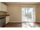 Kitchen with stainless steel dishwasher and granite countertop, with a sliding glass door that leads to an outdoor deck at 4205 Whittier Ct, Decatur, GA 30034