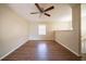 Open-concept living room featuring modern ceiling fan, neutral walls, wood-look flooring, and natural light at 4205 Whittier Ct, Decatur, GA 30034