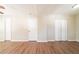 Living room featuring hardwood floors, neutral walls, and multiple doorways, perfect for a versatile living space at 4205 Whittier Ct, Decatur, GA 30034