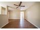 Spacious living room with a modern ceiling fan, neutral walls, and hardwood floors, offering a welcoming space at 4205 Whittier Ct, Decatur, GA 30034