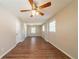 Bright, airy living room showcasing hardwood floors, natural light, neutral paint, and a ceiling fan at 4205 Whittier Ct, Decatur, GA 30034