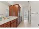 Spacious bathroom features a long vanity with wood cabinets, a white countertop, and tile flooring at 4540 Hastings Dr, Cumming, GA 30041