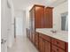 Bright bathroom with wood cabinets and a large mirror over the white countertop with double sinks at 4540 Hastings Dr, Cumming, GA 30041