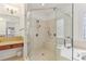 Bathroom with glass enclosed shower, soaking tub and granite vanity at 4540 Hastings Dr, Cumming, GA 30041
