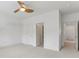 Bedroom with white walls, a ceiling fan, and doorways leading to other rooms at 4540 Hastings Dr, Cumming, GA 30041