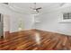 Spacious bedroom with hardwood floors, ceiling fan and natural light at 4540 Hastings Dr, Cumming, GA 30041