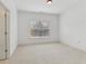 Bright, open carpeted room with natural lighting from a single window at 4540 Hastings Dr, Cumming, GA 30041