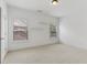 Bright bedroom with neutral carpet, ceiling fan and two windows at 4540 Hastings Dr, Cumming, GA 30041