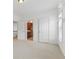 Carpeted bedroom featuring lots of natural light and easy access to a bathroom at 4540 Hastings Dr, Cumming, GA 30041