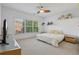 Bedroom features a ceiling fan, and bright natural light at 4540 Hastings Dr, Cumming, GA 30041