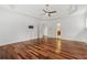 Spacious bedroom with hardwood floors, ceiling fan and white trim throughout at 4540 Hastings Dr, Cumming, GA 30041