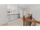 Hallway with wood and wrought iron railing and a chandelier near windows that let in natural light at 4540 Hastings Dr, Cumming, GA 30041