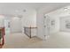 Hallway landing featuring access to a study with glass French doors and neutral colored carpeting at 4540 Hastings Dr, Cumming, GA 30041
