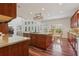 Gourmet kitchen with granite countertops, a central island, and stainless steel appliances at 4540 Hastings Dr, Cumming, GA 30041