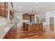 A kitchen featuring granite countertops, wood cabinets, stainless steel appliances and a large island at 4540 Hastings Dr, Cumming, GA 30041