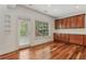 Additional kitchen area with backyard access, custom cabinets, and granite countertops at 4540 Hastings Dr, Cumming, GA 30041