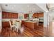 Open concept kitchen with stainless steel appliances, granite countertops, and center island with cooktop at 4540 Hastings Dr, Cumming, GA 30041