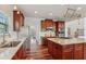 Modern kitchen with granite countertops, stainless steel appliances, and a central island cooktop at 4540 Hastings Dr, Cumming, GA 30041