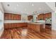 Well-equipped kitchen with stainless steel appliances, center island, and custom cabinetry at 4540 Hastings Dr, Cumming, GA 30041