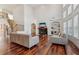 Spacious living room with hardwood floors, a fireplace, and an abundance of natural light at 4540 Hastings Dr, Cumming, GA 30041