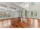 Spacious living room featuring hardwood floors, coffered ceilings, and lots of natural light at 4540 Hastings Dr, Cumming, GA 30041