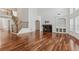 Expansive living room features a staircase, fireplace, and plenty of natural light at 4540 Hastings Dr, Cumming, GA 30041