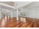 Bright living room with hardwood floors, wainscoting, and a soaring two-story ceiling at 4540 Hastings Dr, Cumming, GA 30041