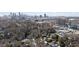 Aerial view showcases Atlanta skyline and the neighborhood's beautiful trees and rooftops at 46 Montclair Ne Dr, Atlanta, GA 30309